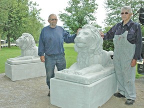 Mitchell Lions Club members Bill French (left) and Clarence McDougall were on hand last Tuesday, Aug. 5 for the installation of two lion statues at the entrance of the Lions Park in Mitchell. The new concrete sculptures, paid for by the Mitchell Lions Club, will adorn the entrance and help identify the park for visitors. KRISTINE JEAN/MITCHELL ADVOCATE