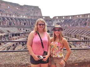 Mikaela Hinz (left), and Sammi Duval stand in front of the Colosseum in Rome during their recent three-week trip to Italy. SUBMITTED