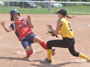 Third baseman Jordyn Elgie (right) of the Mitchell Bantam girls applies the tag to St. Marys’ Jensen Dundas during action from the Huron-Perth league championship game last Sunday, Aug. 10 in Stratford. Mitchell went undefeated to claim the league title. ANDY BADER/MITCHELL ADVOCATE