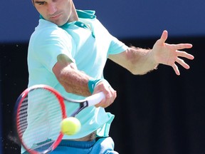 Roger Federer plays Jo-Wilfred Tsonga in the final of the Rogers Cup in Toronto on Sunday, August 10, 2014. (Stan Behal/Toronto Sun)