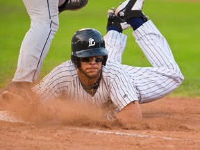 Chris Dennis of the London Majors gets doubled off first base after a Paul LaMantia line drive to second base was caught leaving Dennis running to second in no mans land during game one at Labatt Park in London, Ont. on Friday August 8, 2014. Mike Hensen/The London Free Press/QMI Agency
