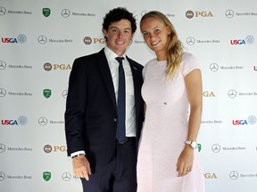 Rory McIlroy and Caroline Wozniacki attend the U.S. Golf Writers Dinner on the eve of the Masters in Augusta, Ga. on April 10, 2013. (Andrew Redington/Getty Images/AFP/Files)