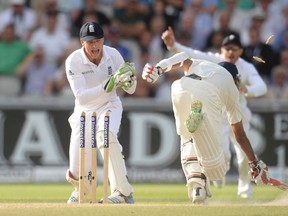 India’s Bhuvneshwar Kumar is run out after England’s Jos Buttler (left) removes the bails during the fourth Test match at Old Trafford on the weekend. (REUTERS)