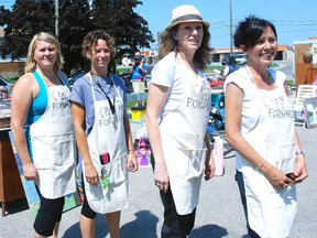 Some of the volunteers who helped out at a fundraiser for victims of an accident at Costco on July 25, are left, Candice Wakulich, Cathy Kostendt, Linda Benardi and Angela Kovacs.
PATRICK BRENNAN QMI Agency
