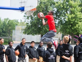The NBA’s No. 1 draft pick, Andrew Wiggins, goes up for a dunk on Monday at Glen Shields Public School in Vaughan, Ont. Wiggins, a Canadian who attended the school, was there to shoot a commercial. (Ernest Doroszuk/Toronto Sun)