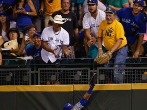 Jose Bautista of the Toronto Blue Jays misses a ball off the bat of Mike Zunino of the Seattle Mariners that went for an RBI triple in the sixth inning at Safeco Field on August 11, 2014. (Otto Greule Jr/Getty Images/AFP)