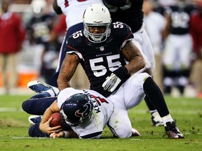 Arizona Cardinals outside linebacker John Abraham (55) sacks Houston Texans quarterback Case Keenum (7) during the game at University of Phoenix Stadium on Nov 10, 2013 in Phoenix, AZ, USA. (Kevin Jairaj/USA TODAY Sports)