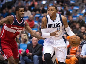Dallas Mavericks small forward Shawn Marion (0) drives to the basket past Washington Wizards small forward Trevor Ariza (1) during the first quarter at the American Airlines Center. (Jerome Miron-USA TODAY Sports)