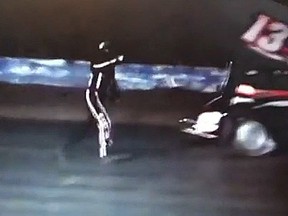 In this YouTube screengrab, Kevin Ward Jr. points to Tony Stewart on the track just before Stewart's car crashes into him. (YouTube)