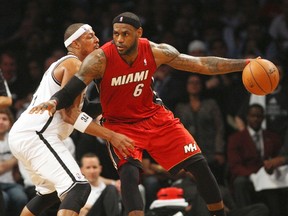 Brooklyn Nets forward Paul Pierce defends against Miami Heat forward LeBron James in Game 4 of the second round of the 2014 NBA Playoffs in New York in this file photo taken May 12, 2014. (REUTERS/Noah K. Murray/USA TODAY Sports/Files)