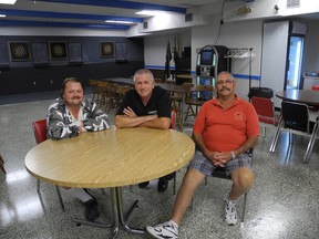 Legion executives, from left, Bruce Gray, Brian Harris and Bob Marshall, sit at The Duchess of Kent Legion building on Hill St. The building is for sale. (Megan Stacey/The London Free Press)