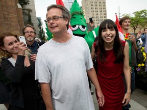 Marc Emery, centre, his wife, Jodie, right, and supporters celebrate his return to Canada on Tuesday after being in a U.S. prison for selling pot seeds online. (CRAIG GLOVER, The London Free Press)