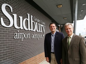 JOHN LAPPA/THE SUDBURY STARJeff Watson, left, parliamentary secretary to Minister of Transport Lisa Raitt, and Bob Johnston, CEO of the Greater Sudbury Airport, were on hand for a funding announcement at the Greater Sudbury Airport on Tuesday, August 12, 2014. Johnston has not returned to his duties as CEO.
