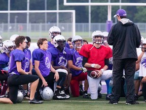 Junior Mustangs players listen to coach Jean-Paul Circelli during practice at TD Stadium on Tuesday night. The London squad plays the Myers Riders in Ottawa for the OVFL Junior Varsity Championship. (DEREK RUTTAN, The London Free Press)