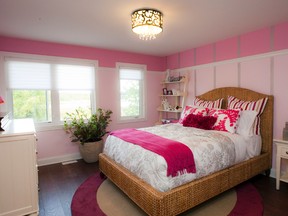Bright wall colours were used to spice up this large bedroom that was designed with a young girl in mind. It’s a Minto design.