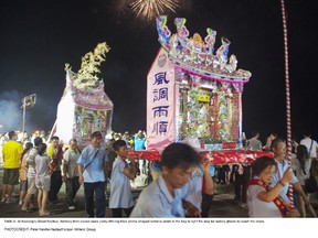 During Keelung’s Ghost Festival, families from 11 clans carry offering-filled shrine-shaped lanterns down to the bay to light the way for watery ghosts to reach the shore. PETER NEVILLE-HADLEY/HORIZON WRITERS' GROUP