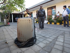This photo taken on August 12, 2014 shows the suitcase where the body of a woman was found inside, displayed at a police station in Nusa Dua on the Indonesian resort island of Bali. (AFP PHOTO/SONNY TUMBELAKA)