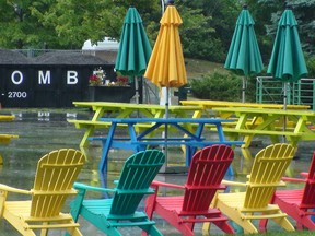 City Hall, in trying to improve the aesthetics of the concrete slab out front, has gussied up Rink of Dreams with colourful picnic tables and Muskoka chairs this year. JON WILLING/OTTAWA SUN
