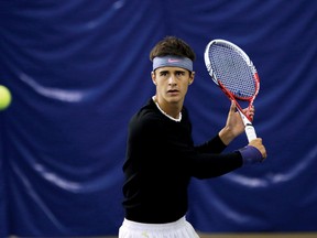 Jason Boudreau, of Sudbury, keeps his eye on the ball during a training session at the Sudbury Tennis Club on Tuesday. The 19-year-old was supposed to leave Wednesday for California to begin a tennis scholarship at Concordia University.