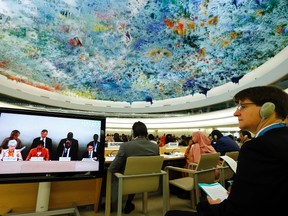 An unidentified delegate listens to U.N. High Commissioner for Human Rights Navi Pillay speak during the 26th session of the Human Rights Council at the United Nations in Geneva June 10, 2014. (REUTERS/Denis Balibouse)