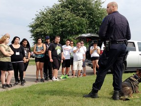 Edmonton Police Service canine unit member Cst. Bryan Langevin and his partner Panzer conducts a demonstration for youths participating in the Aboriginal Youth Police Academy at the EPS Griesbach Training Centre, 14310 – 109 Street on Wednesday August 13, 2014. Pamela Roth/Edmonton Sun/QMI Agency