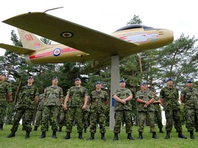 Members of CFB Trenton's Aerospace and Telecommunications Engineering Support Squadron (ATESS) stand near the F-86 Sabre jet that the squadron restored for Belleville's Zwicks Park. A ceremony marking the completion of the two-year-long project was held Wednesday. 
Emily Mountney-Lessard/The Intelligencer/QMI Agency