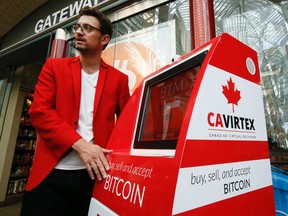 Kyle Kemper, v-p of Business Development at CAVIRTEX, Canada's largest full-scale Bitcoin exchange, launches the BTMs arrival at Gateway Newstands in Brookfield Place Wednesday, August 13, 2014. (Stan Behal/Toronto Sun)