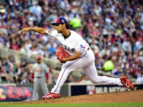 American League pitcher Yu Darvish of the Texas Rangers throws a pitch in the third inning during the 2014 MLB All Star Game at Target Field on July 15, 2014. (Scott Rovak/USA TODAY Sports)