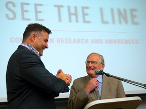 Eric Lindros and Dr. Peter Fowler laugh during introductions during a See The Line session dealing with Concussion research and awareness at Western University in London.
Mike Hensen/The London Free Press/QMI Agency