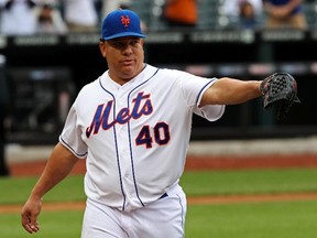New York Mets starting pitcher Bartolo Colon reacts on his way to the dugout in the seventh  inning against the Pittsburgh Pirates at Citi Field on May 28, 2014. (Noah K. Murray/USA TODAY Sports)