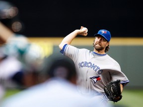 Toronto Blue Jays pitcher R.A. Dickey throws against the Seattle Mariners during the first inning at Safeco Field on August 13, 2014. (Joe Nicholson/USA TODAY Sports)