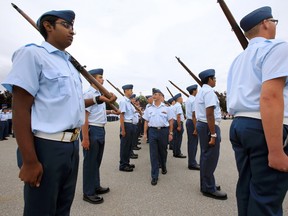 Commanding officer of 8 Wing/CFB Trenton. Col. Dave Lowthian, centre, inspects the parade as reviewing officer, while 650 air cadets from 'General Training Serial 3' at Trenton Cadet Training Centre graduate Thursday morning, Aug. 14, 2014. - Jerome Lessard/The Intelligencer.