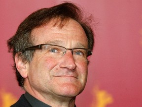 Robin Williams poses during a photocall to present his new movie "The Final Cut" as part of the festival competition at the 54th Berlinale International Film Festival in Berlin in this file picture taken February 11, 2004. Oscar-winning actor and comedian Williams was found dead on Monday from an apparent suicide at his home in Northern California, Marin County Sheriff's Office said. He was 63. REUTERS/Arnd Wiegmann/Files