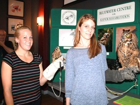 Jenni Kaija and Erica Di Muzio of Blue Water Raptor Rehabilitation stand with friends/raptors Stryker, an American Kestrel, and Luna, a Great Horned Owl at the Limbo Lounge in Sarnia on Aug. 13. The quartet were there to talk to Green Drinks Sarnia about the trials and tribulations of raptors in Lambton County.