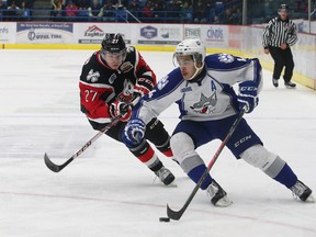 Nick Baptiste, right, of the Sudbury Wolves, attempts to get by Cody Caron, of the Niagara IceDogs, during OHL action at the Sudbury Community Arena in Sudbury on Nov. 29, 2013. The speedy winger is poised to have an amazing season for the Wolves after a stellar training camp with Team Canada a week ago.