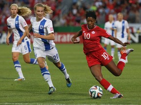 Team Canda midfielder Ashley Lawrence, shown here in action against Finland during the preliminary round in Toronto, describes the team's style of play as combining sped and skill. (Dave Thomas, QMI Agency)