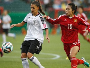 German defender Manjou Wilde says the rain-soaked Aug. 8 game against China at Commnowealth Stadium was the craziest game she ever played in. (Ian Kucerak, Edmonton Sun)