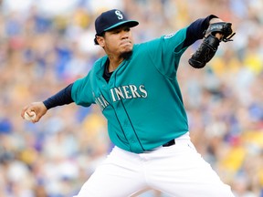 Felix Hernandez of the Seattle Mariners delivers a pitch against the Toronto Blue Jays during the first inning at Safeco Field on Aug. 11, 2014. (STEVEN BISIG/USA TODAY Sports)