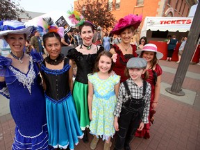 Claire Biggs, centre, and her two daughters Rosalie, 8, front right, and Virginia, front left, pose alongside fellow cast members of the 'Days of Klondike' play, which is part of the  Edmonton International Fringe Festiva,l in Edmonton, AB on August 14, 2014.  The play, which tells the story of Klondike Kate (Rockwell) and the Klondike gold rush, can be seen Aug. 20 to Aug. 23 at the Downtown Edmonton Masonic Hall, 10318 100 Ave. TREVOR ROBB/Edmonton Sun/QMI Agency