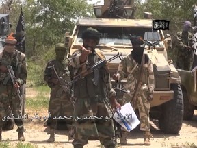 A screengrab taken on July 13, 2014 from a video released by the Nigerian Islamist extremist group Boko Haram and obtained by AFP shows the leader of the Nigerian Islamist extremist group Boko Haram, Abubakar Shekau (C). (AFP PHOTO/BOKO HARAM)