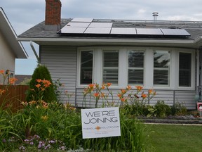 The home of Dan and Sandra Martel was the first in Spruce Grove to have a solar power energy system installed by Solaré Distributors Inc. This photo shows the installation, still in progress. - Caitlin Kehoe, Reporter/Examiner