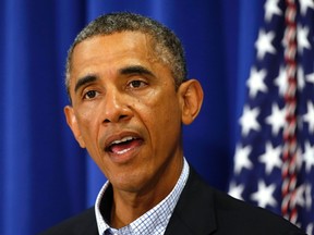 U.S. President Barack Obama speaks about Iraq and also the shooting in Ferguson, Missouri from his vacation on Martha's Vineyard, Massachusetts August 14, 2014. (REUTERS/Kevin Lamarque)