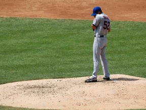 New York Mets starter Carlos Torres (52) stands on the mound after giving up a grand-slam home run to the Washington Nationals' Wilson Ramos during the third inning of their MLB National League baseball game in Washington, July 28, 2013. (REUTERS/Jonathan Ernst)