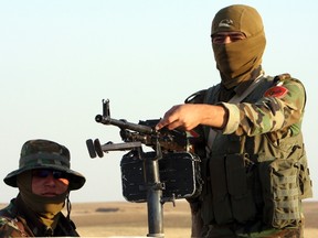 Kurdish peshmerga troops participate in an intensive security deployment against Islamic State militants on the front line in Khazer August 14, 2014. (REUTERS/Azad Lashkari)