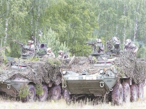 Soldiers from the U.S. Pennsylvania National Guard take part in a field training exercise during the first phase of Saber Strike 2014, at the Rukla military base in Lithuania in June. Saber Strike, a NATO exercise that spanned multiple locations in Latvia, Lithuania and Estonia, involved approximately 4,700 personnel from 10 countries, including Canada. The Western military alliance launched the military manoeuvres, one of its largest, in the ex-Soviet Baltic states after tensions with Moscow spiked over its annexation of Ukraine?s Crimea peninsula. (Petras Malukas/AFP Photo)