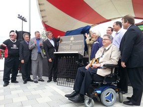 City staff were all smiles as they unveiled a plaque to commemorate the opening of the Lansdowne urban park. JON WILLING/OTTAWA SUN