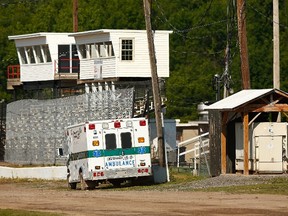 An ambulance is parked on the infield of Canandaigua Motorsports Park where NASCAR Sprint Cup driver Tony Stewart hit and killed driver Kevin Ward Jr. during a dirt track race on Aug. 9 after Ward Jr. had exited his car. (Getty Images/AFP)