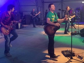 Bonnie Kogos/For The Sudbury Star
At Manitoulin Country Fest, famed Canadian Doc Walker band's lead singer, Chris, invited local guitar talent from AOK, Damian Thibodeau, to perform with them Saturday. Everybody cheered Damian.