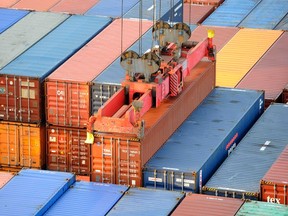 A container is loaded at the Altenwerder shipping terminal at the port in Hamburg in this October 25, 2011 file picture. (REUTERS/Fabian Bimmer/Files)