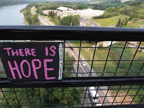 A homemade sign attached to the High Level Bridge in Edmonton Alta., on Friday Aug. 15, 2014. David Bloom/Edmonton Sun/QMI Agency